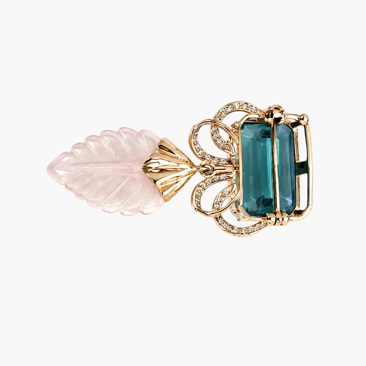 A gold-toned brooch featuring a rectangular emerald-cut teal blue gemstone surrounded by small clear stones, with a pink rose quartz leaf charm attached via a gold connector, shown on a plain white background.