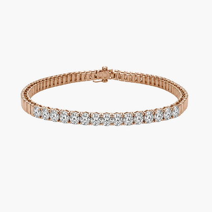 A rose gold tennis bracelet featuring a row of round-cut clear gemstones, displayed on a clean white background.