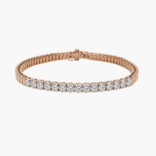 A rose gold tennis bracelet featuring a row of round-cut clear gemstones, displayed on a clean white background.