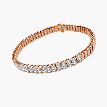 A rose gold tennis bracelet featuring a row of clear round-cut gemstones along the front, displayed on a clean white background.