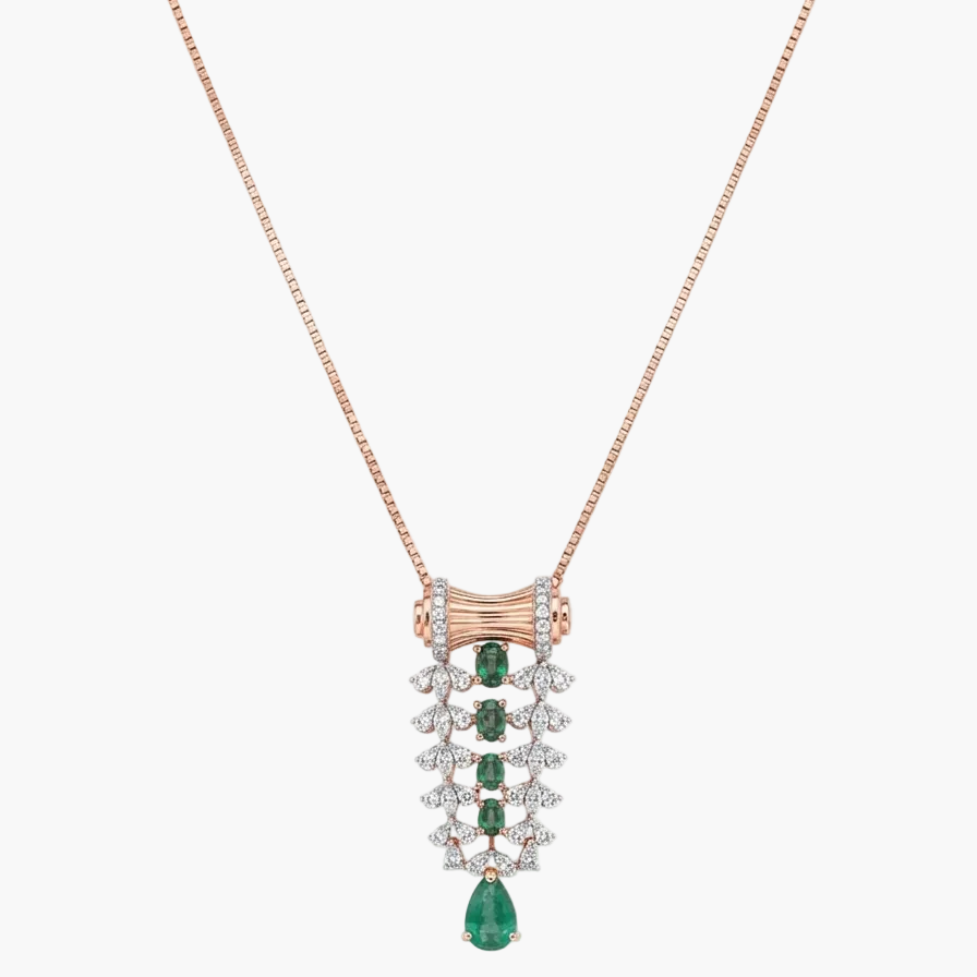 A rose gold necklace with a detailed pendant featuring emerald-cut green gems and clear stones, displayed on a clean white background.