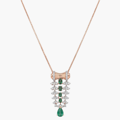 A rose gold necklace with a detailed pendant featuring emerald-cut green gems and clear stones, displayed on a clean white background.
