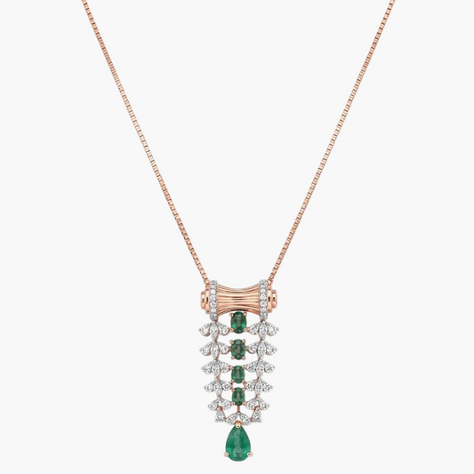 A rose gold necklace with a detailed pendant featuring emerald-cut green gems and clear stones, displayed on a clean white background.