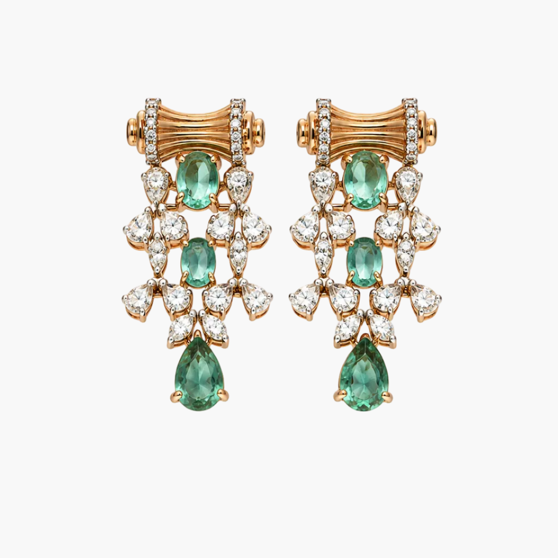 A pair of gold and diamond drop earrings with green emerald-cut gemstones, displayed on a clean white background.