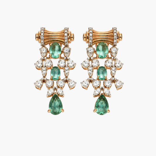 A pair of gold and diamond drop earrings with green emerald-cut gemstones, displayed on a clean white background.