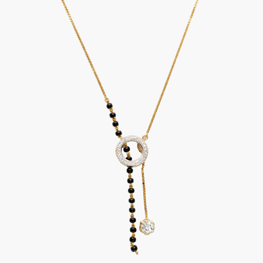 Necklace with black beads and gold chain on a white background