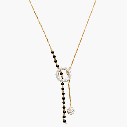 Necklace with black beads and gold chain on a white background
