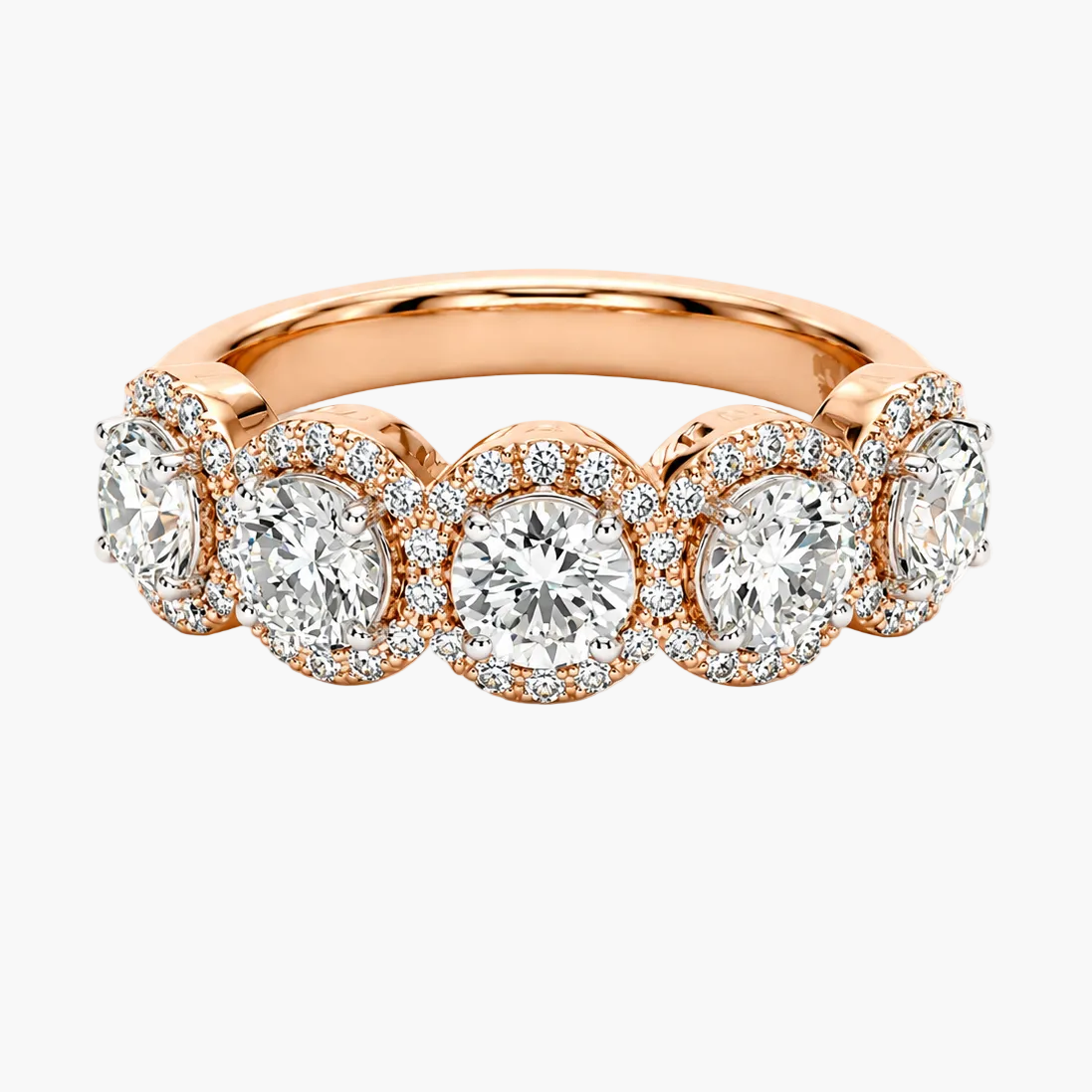 Rose gold ring with diamonds on a white background