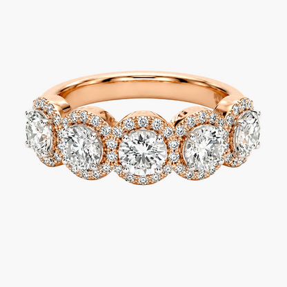 Rose gold ring with diamonds on a white background