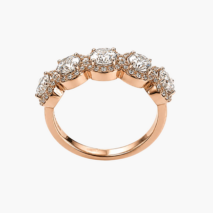 Rose gold ring with diamonds on a white background