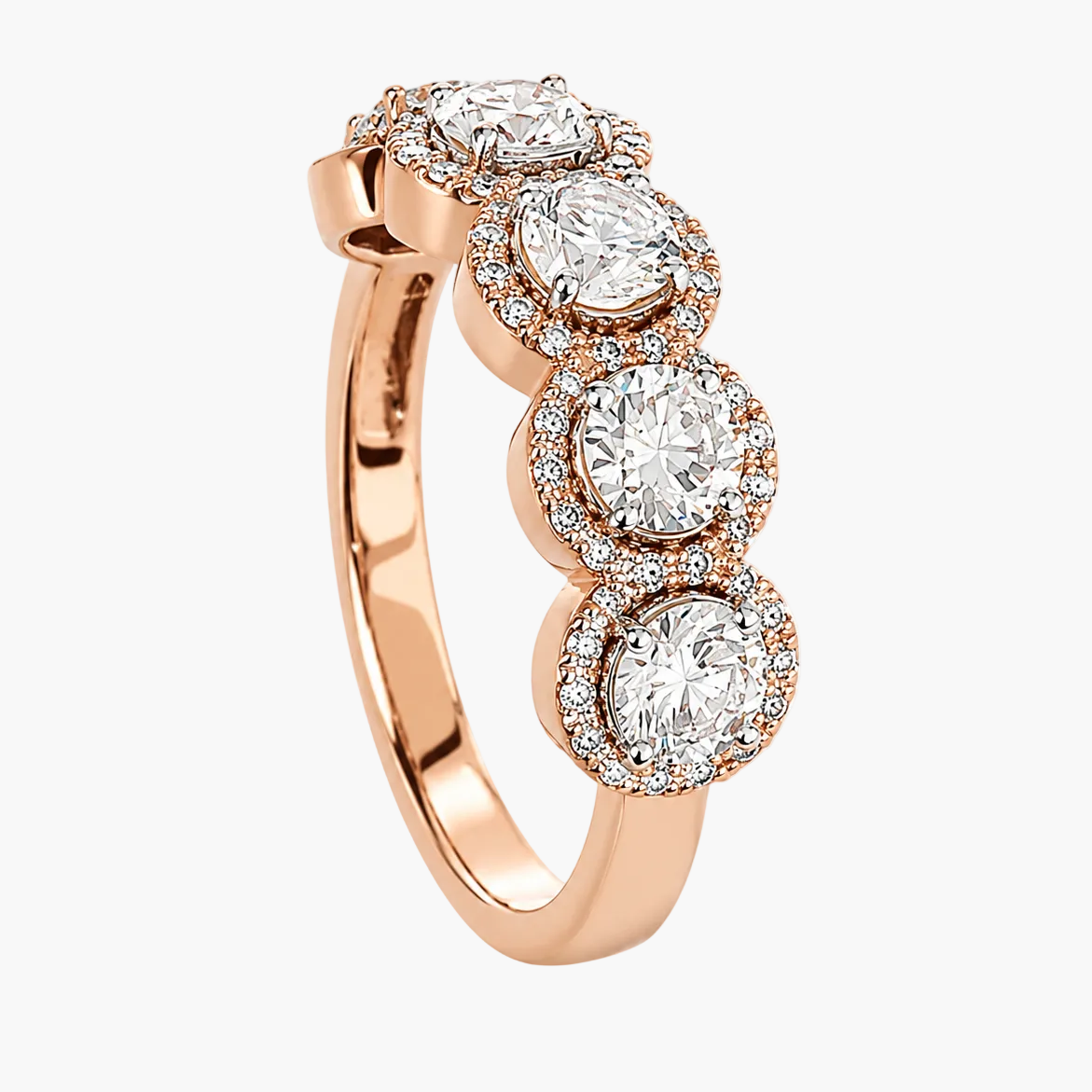 Rose gold ring with three circular diamonds on a white background