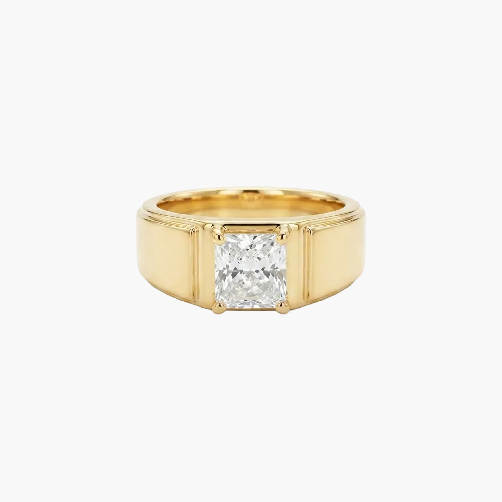 A yellow gold ring featuring a large, square-cut clear gemstone in a four-prong setting, presented on a clean white background.