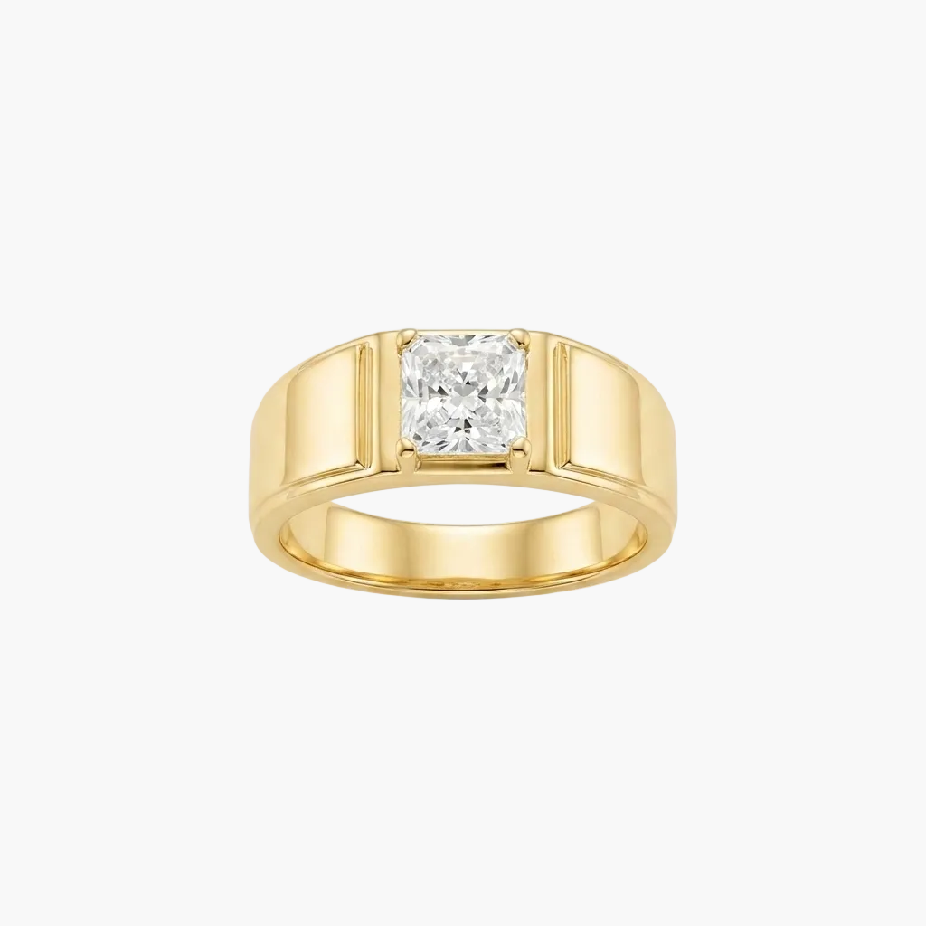 A yellow gold ring featuring a princess-cut diamond center stone in a four-prong setting, presented on a clean white background.