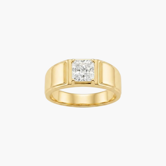 A yellow gold ring featuring a princess-cut diamond center stone in a four-prong setting, presented on a clean white background.