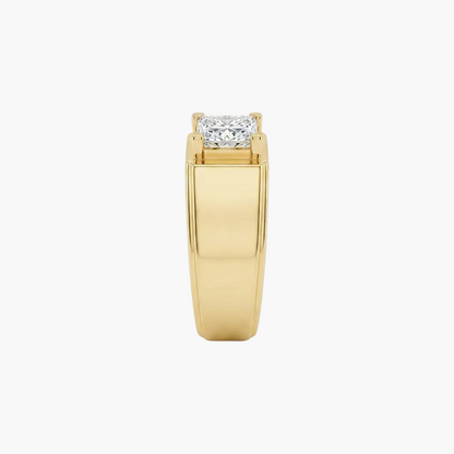 A yellow gold ring with a rectangular prong setting holding a round brilliant-cut diamond, shown against a plain white background.