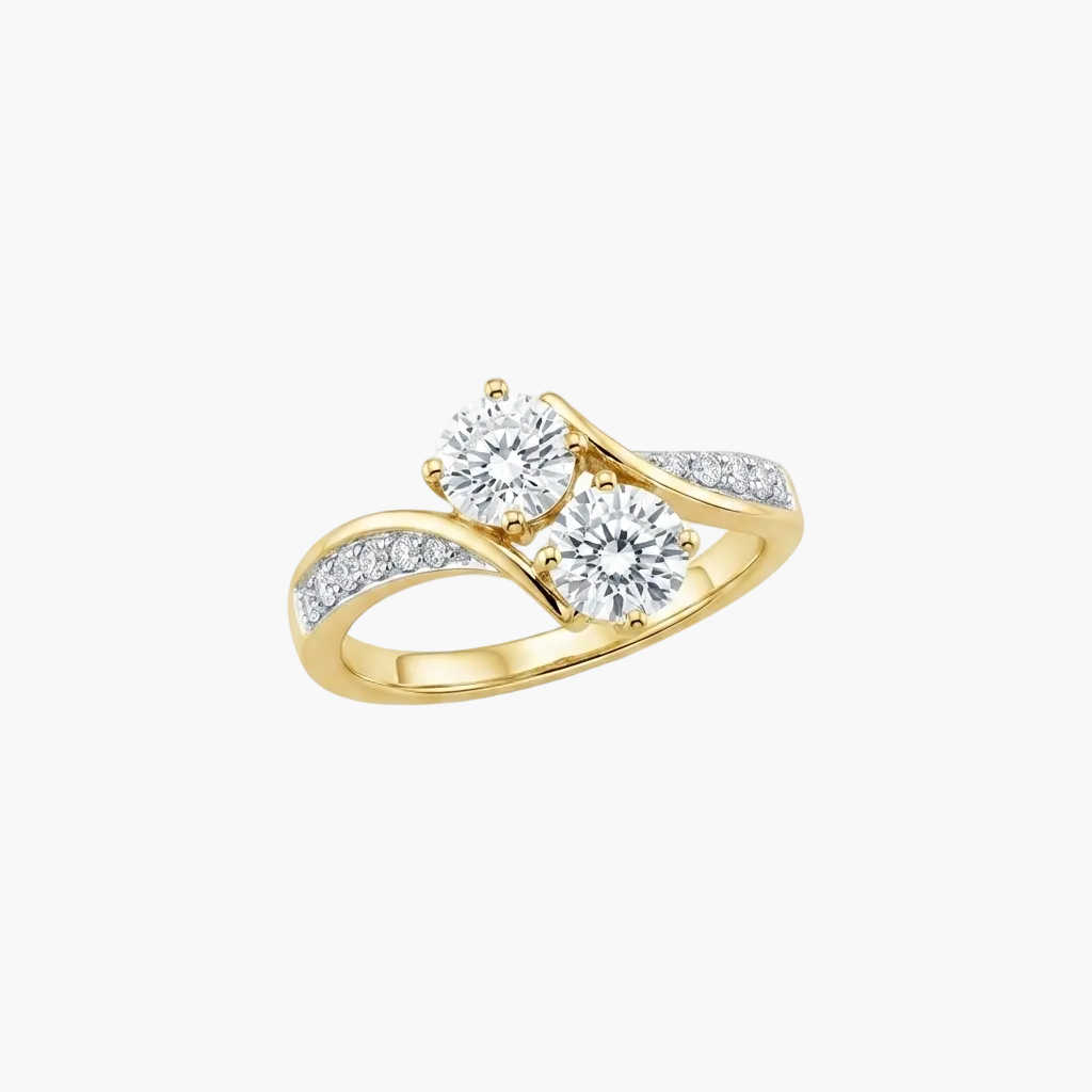 A yellow gold split-shank ring featuring two round brilliant-cut clear center stones and a row of small pavé-set clear stones along the band, shown on a plain white background.
