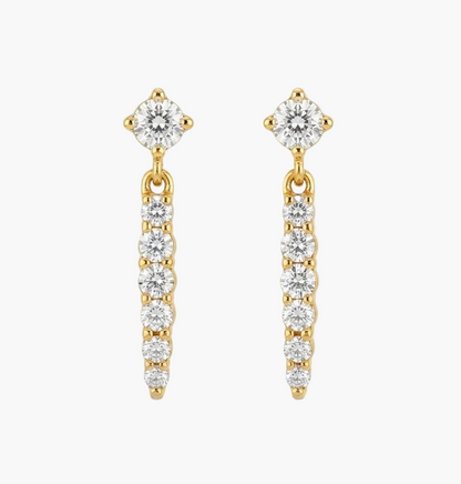 A pair of gold dangle earrings with clear gemstones, shown on a plain white background.