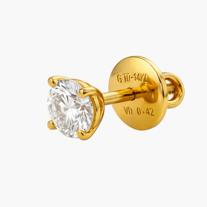 Gold stud earring with a diamond on a white background