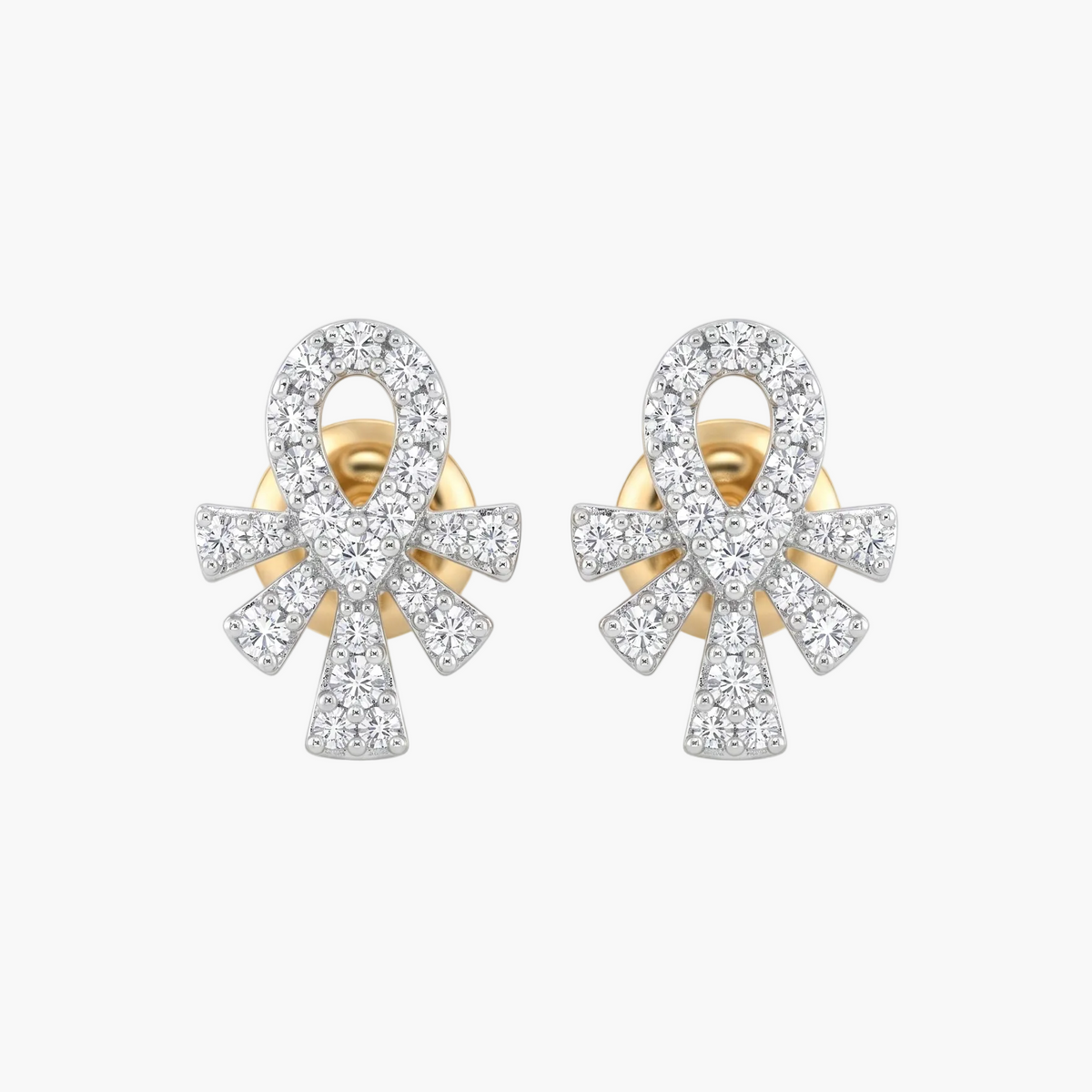 Pair of gold and diamond earrings on a white background