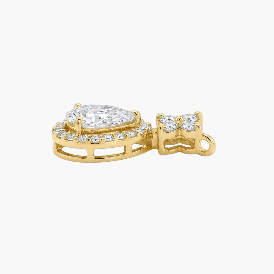 A yellow gold pendant featuring a pear-cut diamond center stone surrounded by a halo of small round diamonds, shown on a clean white background.
