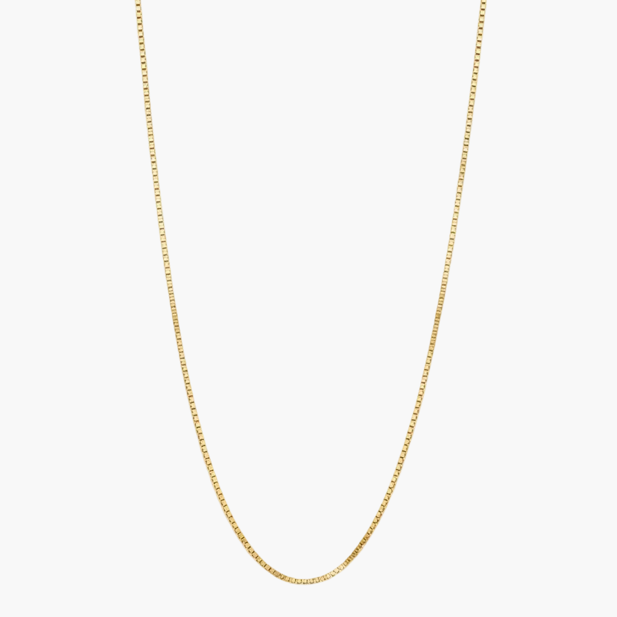 A delicate gold chain necklace with a small lobster clasp, displayed in a U-shape against a clean white background.