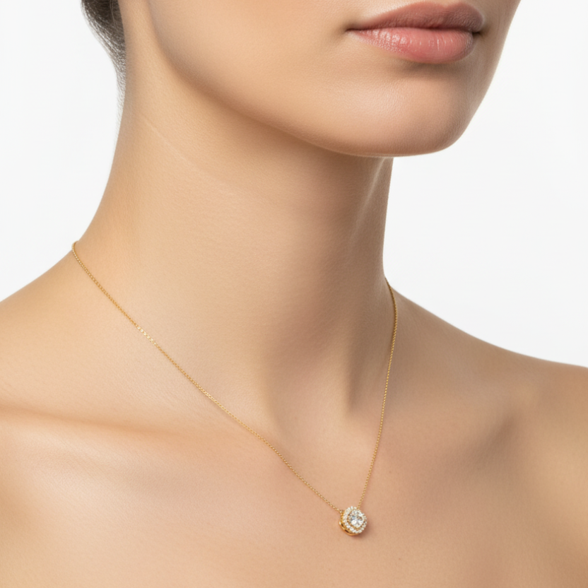 Female model wearing cushion-cut diamond halo pendant necklace
