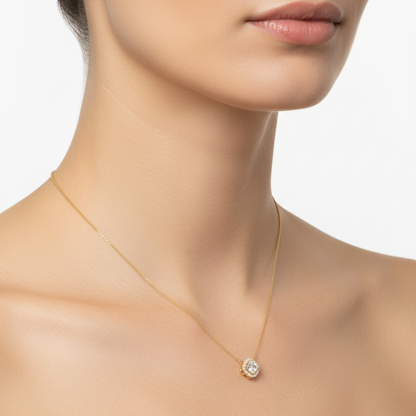 Female model wearing cushion-cut diamond halo pendant necklace
