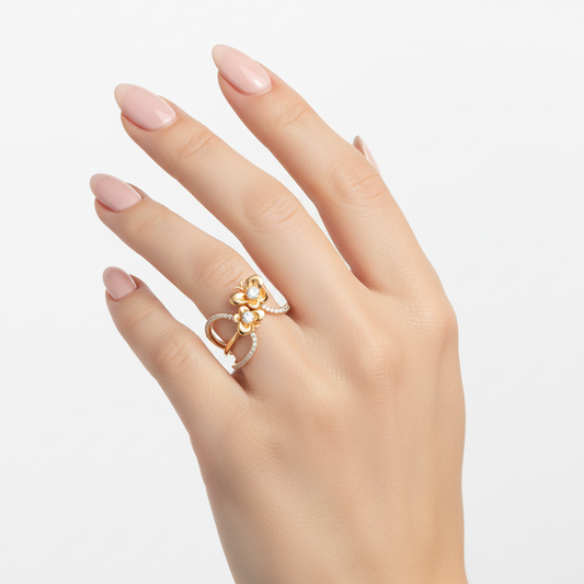 Female model wearing delicate gold floral diamond ring