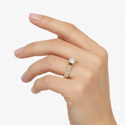 Female model wearing delicate gold solitaire diamond ring
