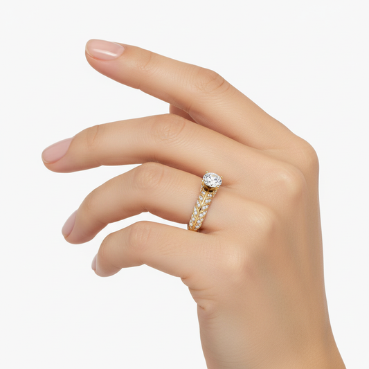 Female model wearing delicate gold solitaire diamond ring