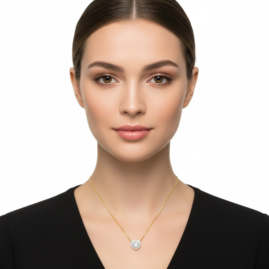 Female model wearing delicate two-tone gold heart-shaped diamond halo pendant