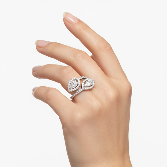 Female model wearing delicate white gold bypass diamond ring