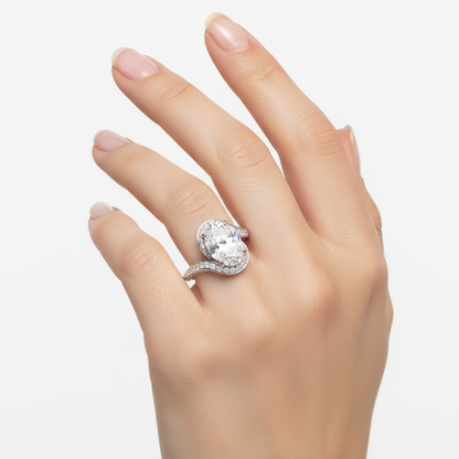 Female model wearing delicate white gold bypass diamond ring