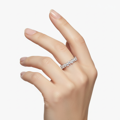 Female model wearing delicate white gold diamond eternity band