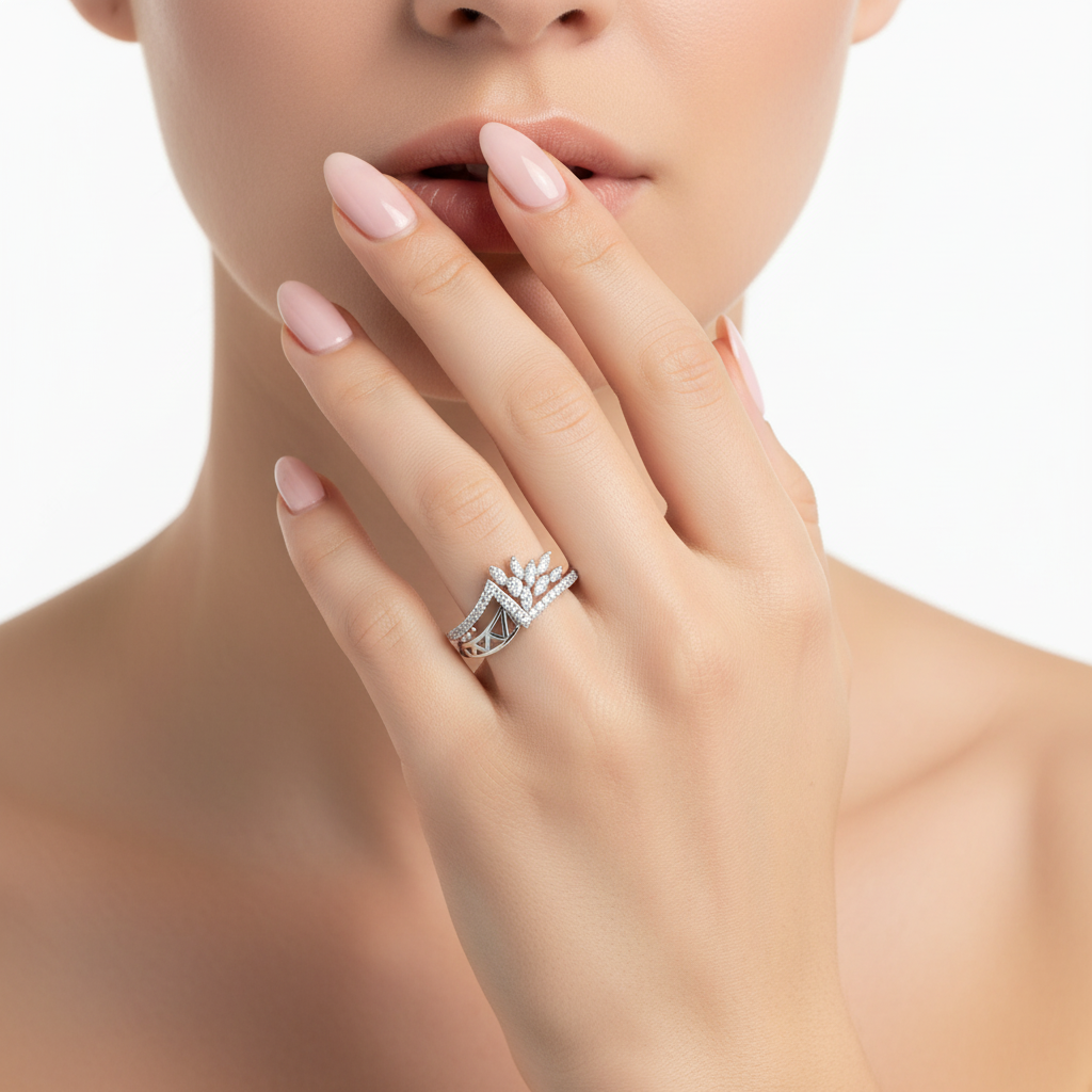 Female model wearing delicate white gold diamond palm leaf ring