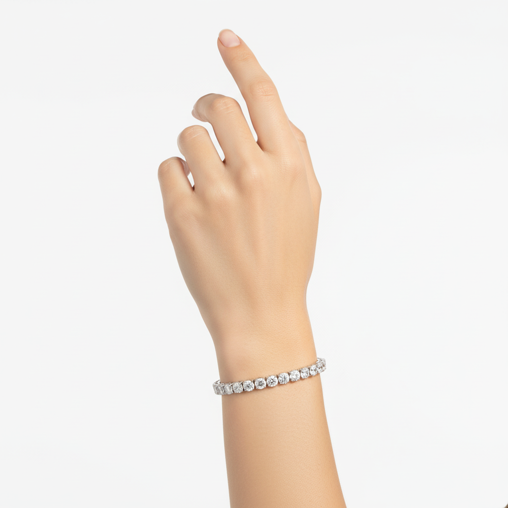 Female model wearing delicate white gold diamond tennis bracelet