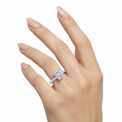 Female model wearing delicate white gold emerald-cut diamond ring