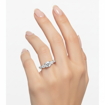 Female model wearing delicate white gold five-stone diamond ring