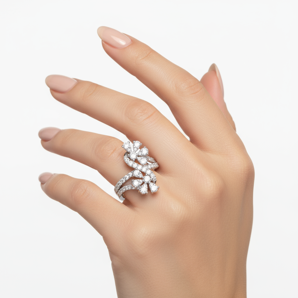 Female model wearing delicate white gold floral diamond ring