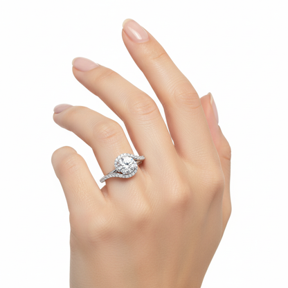Female model wearing delicate white gold halo diamond ring