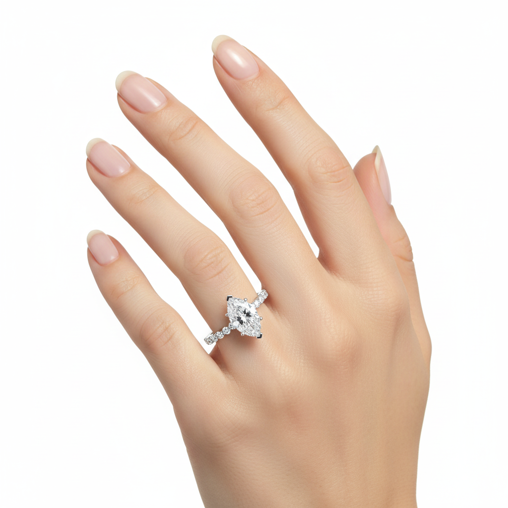 Female model wearing delicate white gold marquise diamond ring