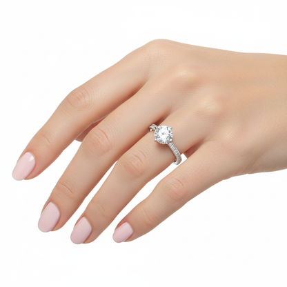 Female model wearing delicate white gold solitaire diamond ring
