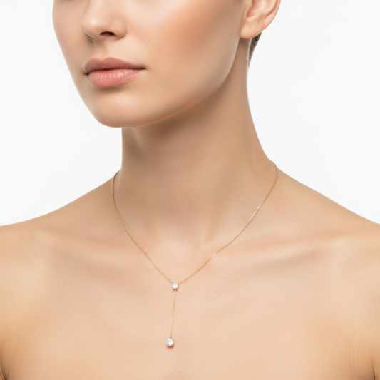 Female model wearing delicate Y-drop diamond necklace