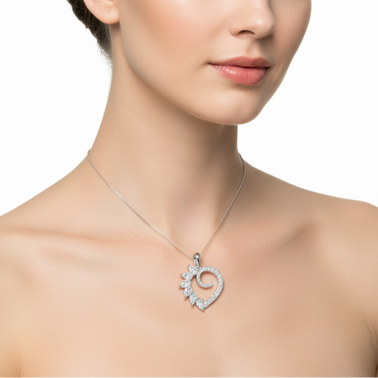 Female model wearing diamond heart pendant with floral accent