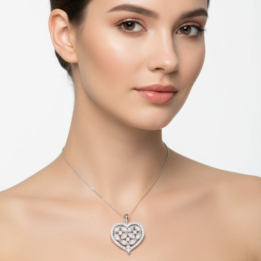 Female model wearing diamond heart pendant with floral design