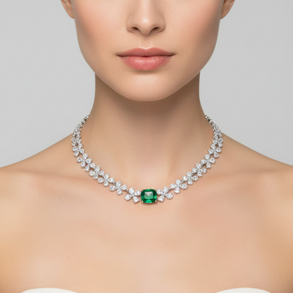 Female model wearing emerald and diamond flower necklace