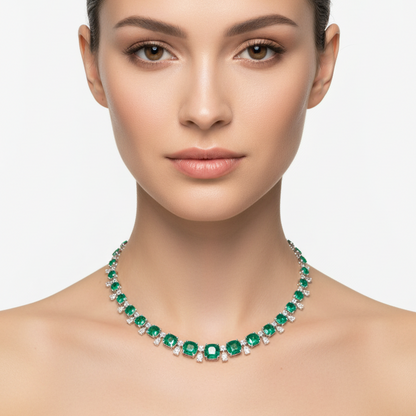 Female model wearing emerald and diamond graduated necklace