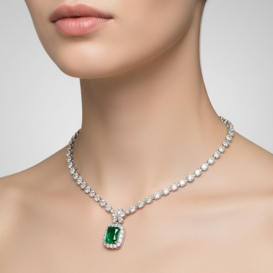 Female model wearing emerald and diamond necklace