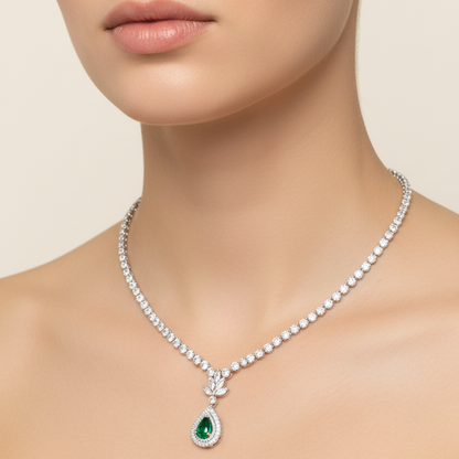 Female model wearing emerald and diamond necklace
