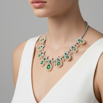 Female model wearing emerald and diamond necklace